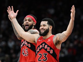 Toronto Raptors guard Fred VanVleet (23) celebrates after causing a turnover as guard Gary Trent Jr. (33) reacts in the against the Minnesota on Wednesday.