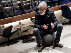 Sanctioned Russian oligarch Roman Abramovich sits in a VIP lounge before a jet linked to him took off for Istanbul from Ben Gurion international airport in Lod near Tel Aviv, Israel, March 14, 2022.