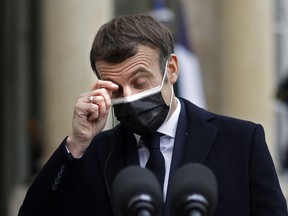 French President Emmanuel Macron gestures as he addresses the press upon the arrival of Portuguese Prime minister for a working lunch on Dec. 16, 2020.