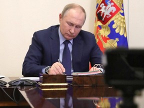 Russian President Vladimir Putin holds a meeting with winners of state culture prizes via a video link at the Novo-Ogaryovo state residence outside Moscow on March 25, 2022.