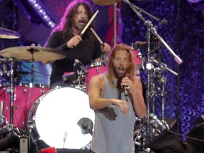 Picture taken on March 18, 2022 of Foo Fighters' drummer Taylor Hawkins and lead singer Dave Grohl on stage, at the Lollapalooza 2022 music festival in Santiago.