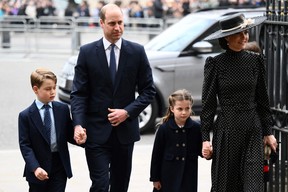 Prince William, Duke of Cambridge (L), Catherine, Duchess of Cambridge (R) and their children Prince George of Cambridge (L) and and Princess Charlotte of Cambridge arrive to attend a Service of Thanksgiving for Prince Philip, Duke of Edinburgh, at Westminster Abbey in central London on March 29, 2022. (DANIEL LEAL/AFP via Getty Images)