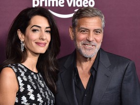 Amal Clooney (L) and husband George Clooney arrive for 