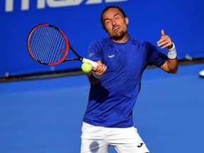 Alexandr Dolgopolov returns the ball to Marin Cilic at the Mexican Open, in Acapulco, on February 28, 2017.