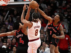 Toronto Raptors guard Armoni Brooks blocks a shot from Cleveland Cavaliers forward Lamar Stevens in the second half at Scotiabank Arena in Toronto, March 24, 2022.