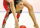 World champion Alina Kabaeva of Russia performs the ball event in the World Rhythmic Gymnastics Club Championships in Tokyo October 10, 1999. Kabaeva scored a perfect 10 points in all four events to win the individual all-around title.