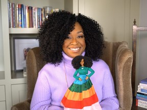 Television producer Shonda Rhimes holds a Barbie doll made in her likeness, as Mattel announces Barbie 2022 Role Models ahead of International Women's Day on March 8, New York, U.S. in this undated handout picture obtained by Reuters March 4, 2022.
