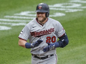 Minnesota Twins third baseman Josh Donaldson (20) smiles as he rounds the bases after hitting a two run home run against the Chicago White Sox during the first inning at Guaranteed Rate Field on June 29, 2021.