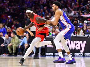 Toronto Raptors forward Pascal Siakam drives with the ball against Philadelphia 76ers forward Tobias Harris in the first quarter at Wells Fargo Center in Philadelphia, Pa., March 20, 2022.