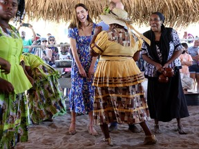 Catherine, Duchess of Cambridge, laughs as she spends time with the locals during her visit to Hopkins, a small village on the coast which is considered to be cultural centre of the Garifuna community in Belize, amid a tour of the Caribbean, March 20, 2022.