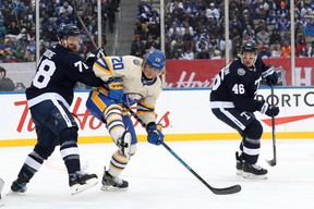 Maple Leafs' TJ Brodie gets tangled up with Buffalo Sabers' Cody Eakin during the second period at Hamilton. CLAUS ANDERSEN/GETTY IMAGES
