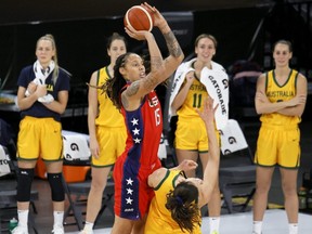 Brittney Griner of the U.S. is fouled as she shoots by Maraianna Tolo of the Australia Opals during an exhibition game at Michelob ULTRA Arena ahead of the Tokyo Olympic Games in Las Vegas, July 16, 2021.