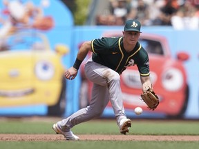 Third baseman Matt Chapman ranges to his left to field a ground ball for the Oakland A’s last season. The three-time Gold Glove slugger was acquired yesterday by the Blue Jays for four prospects.