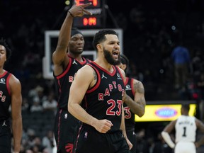 Raptors guard Fred VanVleet (23) and teammates celebrate a basket against the Spurs on Wednesday. night.