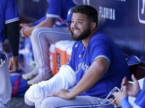 Toronto Blue Jays starting pitcher Alek Manoah sits in the dugout after pitching in the second inning of a spring training baseball game against the New York Yankees, Saturday, March 26, 2022, in Tampa, Fla.