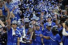 Duke players celebrate after defeating Arkansas in a college basketball game in the Elite 8 round of the NCAA men's tournament in San Francisco, Saturday, March 26, 2022.