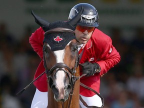 Canada's Eric Lamaze rides Coco Bongo and jumps clear during the first round of the BMO Nations' Cup in the International Ring during The Masters show jumping event at Spruce Meadows in Calgary on September 7, 2019.