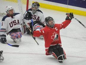 Greg Westlake (#12) celebrates a Team Canada goal against the United States in the final game of the 2011 World Sledge Hockey Challenge at Canada Olympic Park in Calgary.
