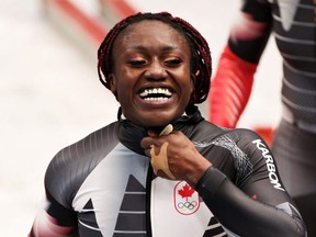 Cynthia Appiah of Team Canada celebrates during the 2-woman Bobsleigh Heat 4 on Day 15 of the Beijing Winter Olympic Games at the National Sliding Centre in Yanqing, China, Feb. 19, 2022.
