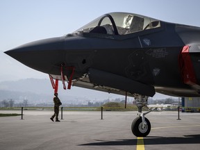 A F-35 A Lightning II fighter jet is displayed during a media presentation on the tarmac of Emmen Air Base, central Switzerland, on March 24, 2022.