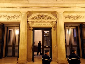 French gendarmes stand in front of France's highest court (Cour de Cassation) in Paris.