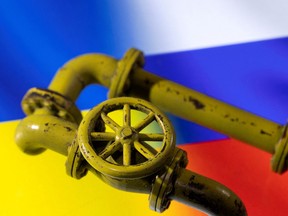 3D printed Natural Gas Pipes are placed on displayed Russia's and Ukraine's flags in this illustration taken on Jan. 31, 2022.