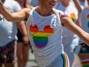 People from the Walt Disney Company participate in the annual LA Pride Parade in West Hollywood, California, on June 9, 2019.(Photo credit should read DAVID MCNEW/AFP via Getty Images)