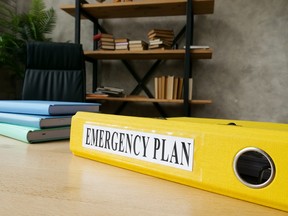 An emergency plan in a yellow folder.