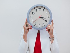 Woman with clock time management and biological time concept