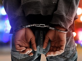 This illustration shows a man in handcuffs