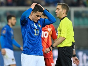 Italy's forward Giacomo Raspadori reacts at the end of the 2022 World Cup qualifying playoff match against North Macedonia, on March 24, 2022 at the Renzo-Barbera stadium in Palermo.