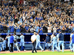 Blue Jays fans applaud their team off the field after a season-ending victory over the Baltimore Orioles at Rogers Centre in 2021.