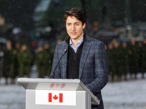 Canada's Prime Minister Justin Trudeau addresses a news conference at the end of a visit of the Adazi military base, north east of Riga, Latvia, on March 8, 2022.