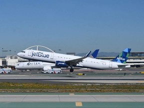 A JetBlue Airways Airbus A321 takes off from Los Angeles International Airport in Los Angeles, Feb. 19, 2022.