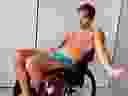 Young man in underwear in wheelchair.