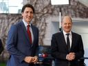 German Chancellor Olaf Scholz (right) greets Canadian Prime Minister Justin Trudeau upon his arrival at the Chancellery in Berlin for talks on Wednesday, March 9, 2022.
