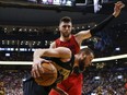 Trail Blazers centre Jusuf Nurkic (red jersey) in action against the Raptors in Toronto, Feb. 2, 2018.