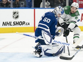 Dallas Stars' Jason Robertson battles for the puck in front of Maple Leafs goaltender Erik Kallgren during the second period at Scotiabank Arena on Tuesday, March 15, 2022.