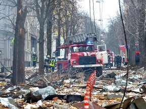 Firefighters work to contain a fire in the complex of buildings housing the Kharkiv regional SBU security service and the regional policein Kharkiv on March 2, 2022.