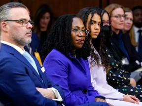 Supreme Court nominee Ketanji Brown Jackson, second from left, sits with her husband Dr. Patrick Jackson, left, and daughters Leila Jackson, third from left, and Talia Jackson as she is introduced during her Senate Judiciary Committee confirmation hearing on Capitol Hill in Washington, D.C., Monday, March 21, 2022.