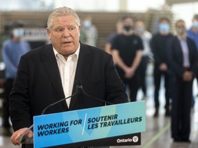 Ontario Premier Doug Ford speaks at Armatec, a military manufacturer in Dorchester east of London, Ont., Feb. 25, 2022.