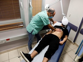Nerve damage may explain some cases of long COVID: US study A patient suffering from long COVID is examined in the post-COVID-19 clinic of Ichilov Hospital in Tel Aviv, Israel, Feb. 21, 2022.