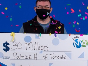 Patrick Hale, of Toronto, with his Lotto Max cheque for $30 million.