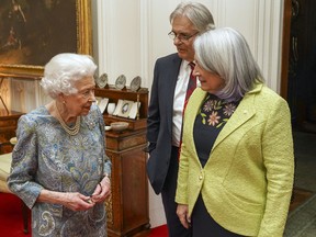 Queen Elizabeth II welcomes the Governor General of Canada, Mary Simon, and her husband, Whit Fraser, for tea in the Oak Room at Windsor Castle on March 15, 2022.