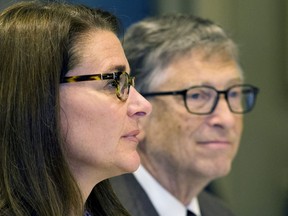 Melinda French Gates (left) and Bill Gates attend a news conference.