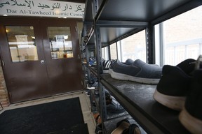 A man enters the Dar Al-Tawheed Islamic Centre mosque to pray. JACK BOLAND/TORONTO SUN