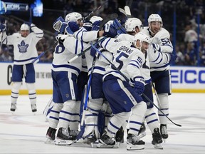 The Toronto Maple Leafs celebrate after the team defeated the Tampa Bay Lightning during overtime in Game 6 of an NHL hockey Stanley Cup first-round playoff series Saturday, April 29, 2023, in Tampa, Fla.