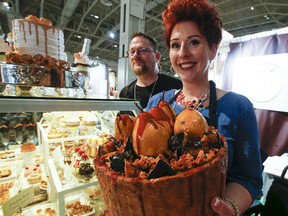 Jennifer Chartrand of Puslinch, Ont., and her husband, Marty, show off her faux food artistry at the One Of A Kind Show at Exhibition Place.
(Jack Boland / Toronto Sun)