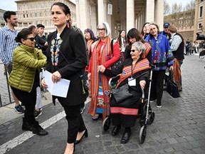 Canada's Metis National Council President, Cassidy Caron (left), arrives along with delegations members to address the media on March 28, 2022 at St. Peter's square in The Vatican.