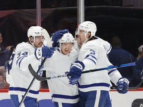 Maple Leafs defenceman Rasmus Sandin (38) is congratulated by teammates after scoring a goal against the Washington Capitals on Monday. Sandin moved up to a defensive pairing with Morgan Rielly at practice on Tuesday.